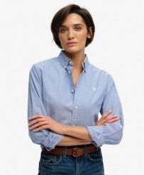 Superdry Damska Koszula Slim Oxford z Długim Rękawem z Bawełny Organicznej. Niebieskie koszule Superdry, bez wzorów, z bawełny, bez kołnierzyka, bez ramiączek. Za 314.00 zł.