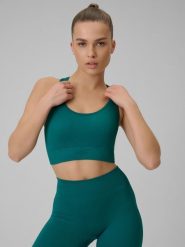 4F Biustonosz treningowy bezszwowy z niskim wsparciem damski - turkusowy XS/S. Niebieskie biustonosze sportowe 4f, bez wzorów, z materiału. Za 89.99 zł.