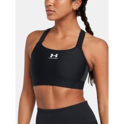 Stanik sportowy do jogi i pilatesu damski Under Armour. Czarne biustonosze sportowe Under Armour, bez wzorów, na fitness i siłownię. Za 149.99 zł.
