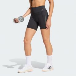 Krótkie legginsy Optime Workout 3-Stripes. Czarne legginsy adidas, bez wzorów, z lycry, sportowe, krótkie. Za 199.00 zł.