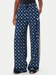 Guess Spodnie dresowe V5YB10 K0282 Granatowy Relaxed Fit. Niebieskie spodnie dresowe Guess, z aplikacjami, z dresówki. Za 329.99 zł.
