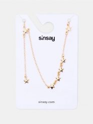 Naszyjnik z gwiazdkami - złoty. Żółte naszyjniki Sinsay, złote. Za 9.99 zł.