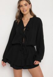 Czarny Wiązany Bawełniany Kombinezon Boho z Falbankami i Wiązaniem Lalelia. Czarne sukienki Born2be, na co dzień, uniwersalny, bez wzorów, z bawełny, boho, bez kołnierzyka, bez ramiączek, proste. W wyprzedaży za 144.49 zł.