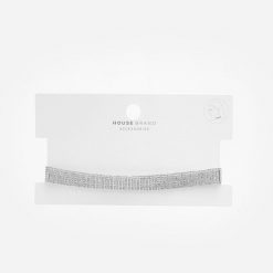 Naszyjnik choker z kryształkami - Srebrny. Szare naszyjniki House, srebrne. W wyprzedaży za 29.99 zł.