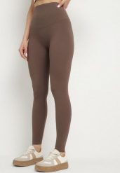Brązowe Klasyczne Legginsy z Wysokim Stanem Melio. Brązowe legginsy Born2be, bez wzorów, z jeansu, klasyczne. W wyprzedaży za 42.49 zł.