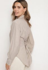 Ciemnobeżowa Koszula z Usztywnionymi Ramionami Ozdobiona Sznurkiem Meroriela. Brązowe koszule Born2be, uniwersalny, bez wzorów, z jeansu, eleganckie, bez kołnierzyka, bez ramiączek. W wyprzedaży za 84.99 zł.