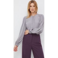 Sisley bluzka damska kolor szary gładka. Szare bluzki Sisley, l, bez wzorów, z tkaniny, bez kołnierzyka, bez ramiączek. Za 279.99 zł.