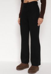 Czarne Prążkowane Spodnie z Wełną o Szerokim Kroju z Wysokim Stanem Reinnia. Czarne spodnie materiałowe Born2be, bez wzorów, z jeansu, z podwyższonym stanem. Za 79.99 zł.