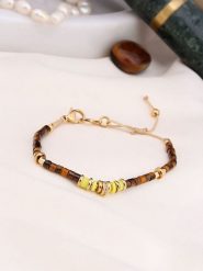 Charlize Pozłacana bransoletka z tygrysim okiem rozmiar: onesize. Brązowe bransoletki Charlize, pozłacane. Za 95.69 zł.