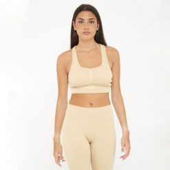 Crop top sportowy ICONIC. Brązowe biustonosze sportowe LEGEA, bez wzorów, z elastanu, na fitness i siłownię. W wyprzedaży za 72.00 zł.