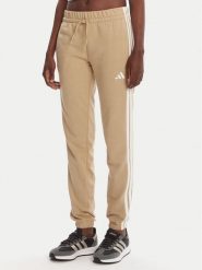 Adidas Spodnie dresowe Essentials 3-Stripes JX7661 Beżowy Regular Fit. Brązowe spodnie dresowe adidas, bez wzorów, z bawełny. Za 159.99 zł.