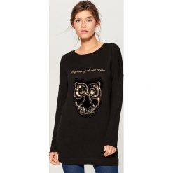 Sweter z cekinową aplikacją - Czarny. Swetry marki DOMYOS. W wyprzedaży za 59.99 zł.