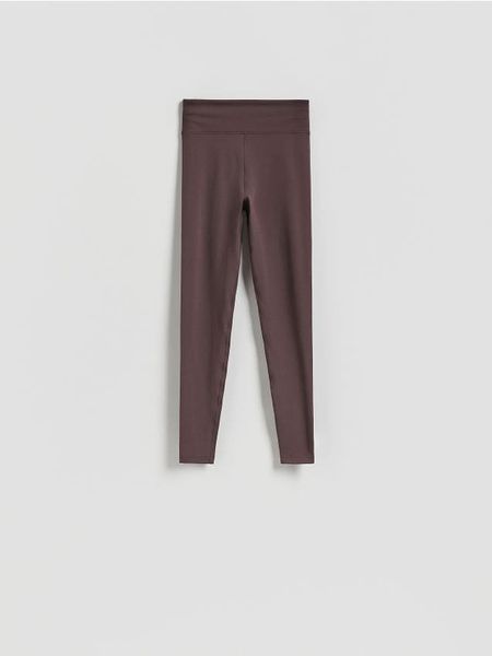 Gładkie legginsy - brązowy. Brązowe legginsy Reserved, bez wzorów, z dzianiny. Za 89.99 zł.