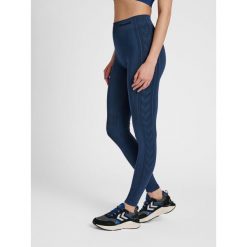 Damskie legginsy mid-rise Hummel Shaping. Niebieskie legginsy Hummel, bez wzorów, z materiału, sportowe. Za 163.50 zł.