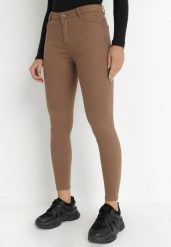 Ciemnobrązowe Spodnie Skinny Commins. Brązowe jeansy Born2be, l, bez wzorów, z jeansu, eleganckie, długie. Za 79.99 zł.