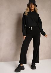 Czarne Spodnie z Dodatkiem Wiskozy High Waist o Szerokim Kroju ze Sznurkami Isnia. Czarne jeansy Renee, bez wzorów, z jeansu, eleganckie, z podwyższonym stanem. W wyprzedaży za 39.99 zł.