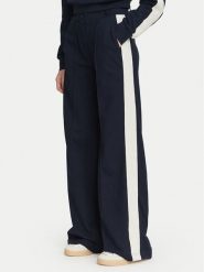 Guess Spodnie materiałowe V6YB26 K5139 Granatowy Relaxed Fit. Niebieskie spodnie dresowe Guess, z aplikacjami, z bawełny. Za 434.99 zł.