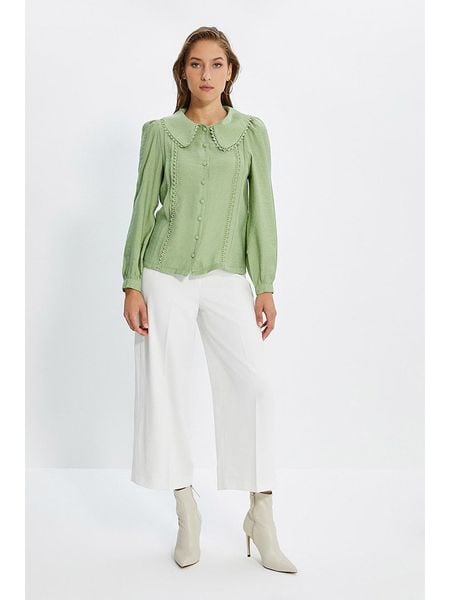 Trendyol Bluzka w kolorze zielonym rozmiar: 36. Zielone bluzki Trendyol, bez wzorów, z koronki, bez kołnierzyka, bez ramiączek. Za 70.08 zł.