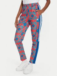 Adidas Spodnie dresowe FARM Rio IQ4492 Czerwony Regular Fit. Czerwone spodnie dresowe adidas, bez wzorów, z bawełny. Za 299.99 zł.