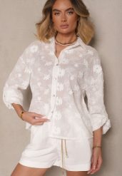 Biała Bawełniana Koszula o Kroju Oversize z Haftem w Kwiatowy Wzór Reisariel. Białe koszule Renee, m, bez wzorów, z bawełny, eleganckie, bez kołnierzyka, bez ramiączek. W wyprzedaży za 91.99 zł.