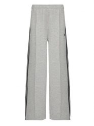 Adidas Spodnie dresowe adicolor Spacer 3-Stripes JV7497 Zielony Wide Leg. Zielone spodnie sportowe adidas, bez wzorów, z dresówki, trekkingowe. Za 349.99 zł.