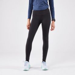Legginsy do biegania damskie Kiprun Run 500 Warm ocieplane. Czarne legginsy KIPRUN, bez wzorów, z elastanu, sportowe. Za 139.99 zł.