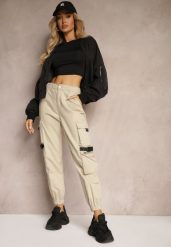 Jasnobeżowe Spodnie Joggery z Kieszeniami Cargo z Elastycznej Bawełny Irisane. Brązowe jeansy Renee, l, bez wzorów, z bawełny, eleganckie. W wyprzedaży za 91.99 zł.