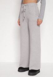 Szare Dzianinowe Spodnie o Szerokim Kroju ze Sznurkami Melatusa. Szare jeansy Born2be, l, bez wzorów, z dzianiny, eleganckie, z podwyższonym stanem. Za 99.99 zł.
