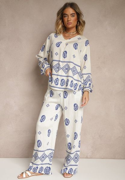 Biało-Niebieski Komplet w Stylu Etno Spodnie z Gumką w Pasie i Bluzka Oversize Eviralyn. Białe bluzki Renee, bez wzorów, eleganckie, bez kołnierzyka, bez ramiączek. Za 129.99 zł.
