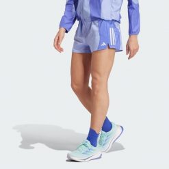 Szorty Own the Run Base AEROREADY. Niebieskie szorty adidas, bez wzorów, z materiału, sportowe. Za 170.20 zł.