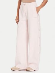 Guess Spodnie dresowe V5BB12 KCX22 Różowy Wide Leg. Czerwone spodnie dresowe Guess, z aplikacjami, z dresówki. Za 379.99 zł.