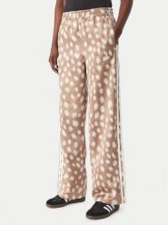 Adidas Spodnie dresowe Firebird KT2144 Brązowy jasny Wide Leg. Brązowe spodnie dresowe adidas, bez wzorów, z dresówki. Za 349.99 zł.