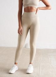 Damskie legginsy bezszwowe, prążkowane, wysoki stan, squat proof beżowe. Brązowe legginsy AIM'N, bez wzorów, z dzianiny, street. Za 254.00 zł.