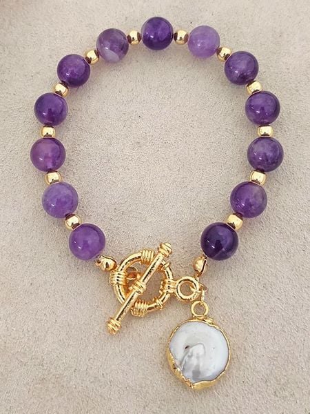 Luja Bijoux Pozłacana bransoletka z ametystami i perłą rozmiar: onesize. Różowe bransoletki Luja Bijoux, z ametystem, pozłacane. Za 61.46 zł.