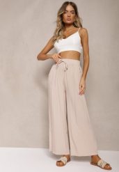 Beżowe Bawełniane Szerokie Spodnie Kuloty High Waist z Gumką w Talii Evitaes. Brązowe jeansy Renee, l, bez wzorów, z bawełny, biznesowe, z podwyższonym stanem. Za 39.99 zł.