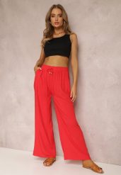 Czerwone Spodnie Karrill. Czerwone jeansy Renee, na lato, l, bez wzorów, z jeansu, eleganckie, długie. W wyprzedaży za 39.99 zł.