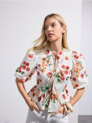 Wiązana bluzka z baskinką - złamana biel. Bluzki Reserved, l, bez wzorów, z bawełny, bez kołnierzyka, bez ramiączek. Za 139.99 zł.