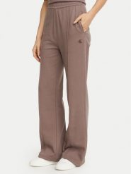 Calvin Klein Jeans Spodnie dresowe Monogram LV047H220G Beżowy ciemny Regular Fit. Brązowe spodnie dresowe Calvin Klein Jeans, bez wzorów, z bawełny. Za 369.99 zł.