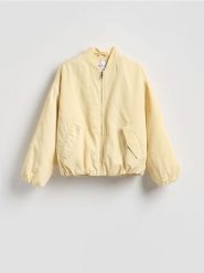 Kurtka bomber - jasnożółty. Żółte kurtki Reserved, l, bez wzorów, z tkaniny, bez kaptura. Za 199.99 zł.