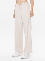 Tommy Hilfiger Spodnie dresowe UW0UW04771 Beżowy Relaxed Fit. Brązowe spodnie dresowe Tommy Hilfiger, bez wzorów, z dresówki. Za 199.99 zł.