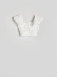 Bluzka z falbankami - złamana biel. Bluzki Reserved, l, bez wzorów, z dzianiny, bez kołnierzyka, bez ramiączek. W wyprzedaży za 19.99 zł.