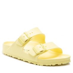 Klapki Birkenstock. Żółte klapki Birkenstock, bez wzorów, bez obcasa, bez zapięcia. Za 249.99 zł.