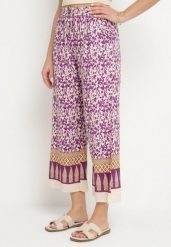 Fioletowe Bawełniane Spodnie z Wysokim Stanem o Długości 7/8 ze Wzorem Boho Lisavinea. Fioletowe jeansy Born2be, z aplikacjami, z bawełny, boho, z podwyższonym stanem. Za 49.99 zł.