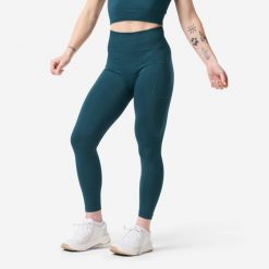 Legginsy do treningu siłowego damskie Domyos bezszwowe. Niebieskie legginsy DOMYOS, bez wzorów, z dzianiny, długie. Za 99.99 zł.