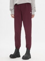 Reebok Spodnie dresowe Classics Franchise IL4627 Bordowy Relaxed Fit. Czerwone spodnie dresowe Reebok, bez wzorów, z dresówki. Za 159.99 zł.