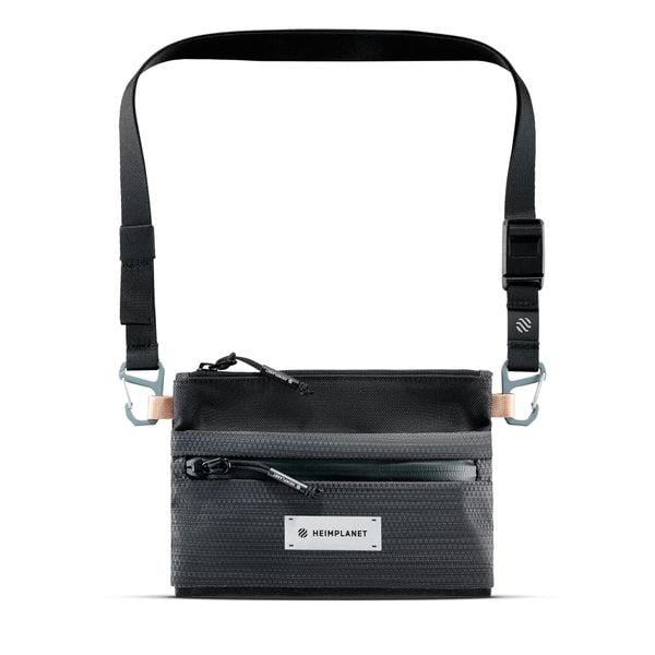 Saszetka na szyję Heimplanet Carry Essentials. Szare nerki i saszetki HEIMPLANET, bez wzorów, z materiału, klasyczne, bez dodatków. Za 184.50 zł.