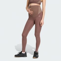 Legginsy Optime Essentials Full-Length (Maternity). Brązowe legginsy adidas, bez wzorów, z materiału. W wyprzedaży za 135.78 zł.
