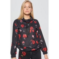 Bluza kwiatowa MIX and MATCH - Czarny. Bluzy marki DOMYOS. W wyprzedaży za 39.99 zł.