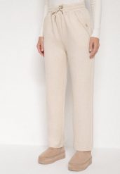 Jasnobeżowe Spodnie z Wysokim Stanem Ozdobione Sznurkami Akleria. Brązowe jeansy Born2be, l, bez wzorów, z jeansu, z podwyższonym stanem. Za 79.99 zł.