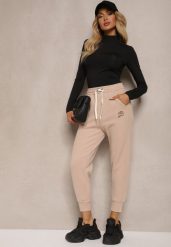 Beżowe Spodnie Dresowe Joggery z Gumką w Pasie i Futrzaną Wyściółką Sevirina. Brązowe jeansy Renee, m, bez wzorów, z dresówki, eleganckie, z podwyższonym stanem. W wyprzedaży za 43.99 zł.